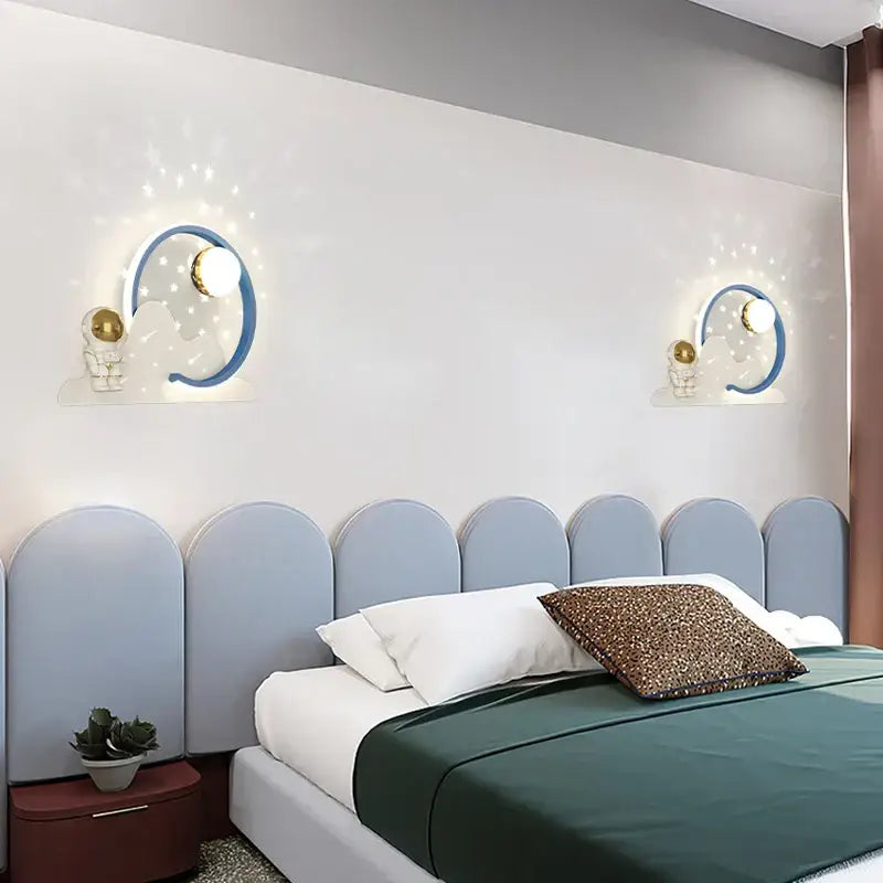 Modern white astronaut moon wall lamp featuring blue crescent moon sconces with gold astronaut decorbites astronaut moon design