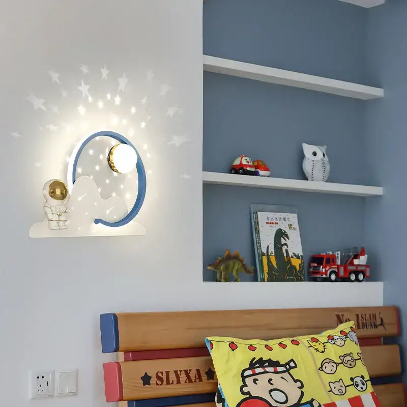 Blue and white cloud-shaped wall lamp with star projection by decorbites astronaut moon for children’s bedroom decor