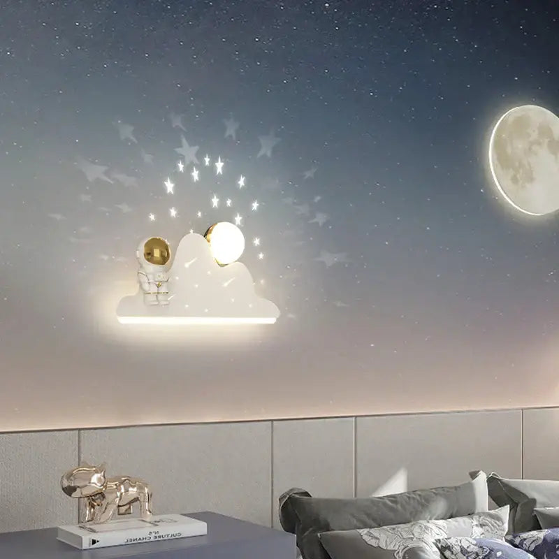Modern white astronaut moon wall lamp with golden astronaut and moon design featuring starlight illumination for bedroom decorbites astronaut moon