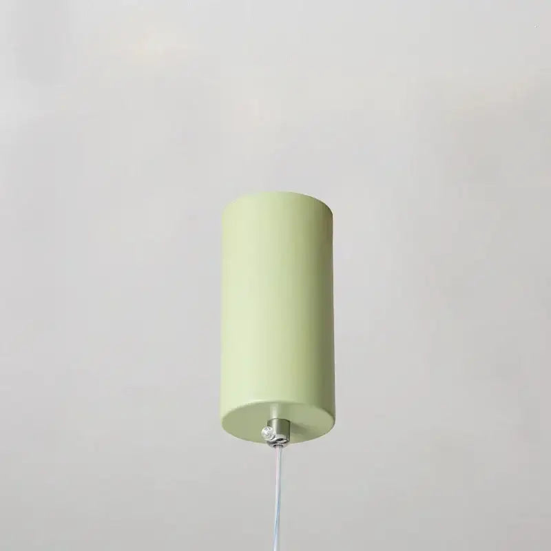 Modern white bead nordic chandelier featuring a sleek pale green cylindrical pendant light with metallic hardware
