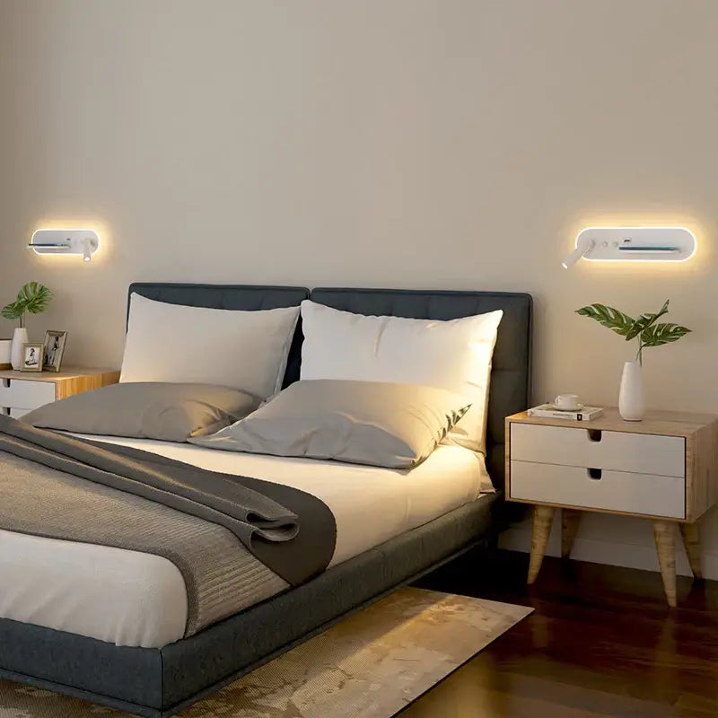 Modern white bedside wall lamp with sleek minimalist design and wireless charging for ambient bedroom lighting