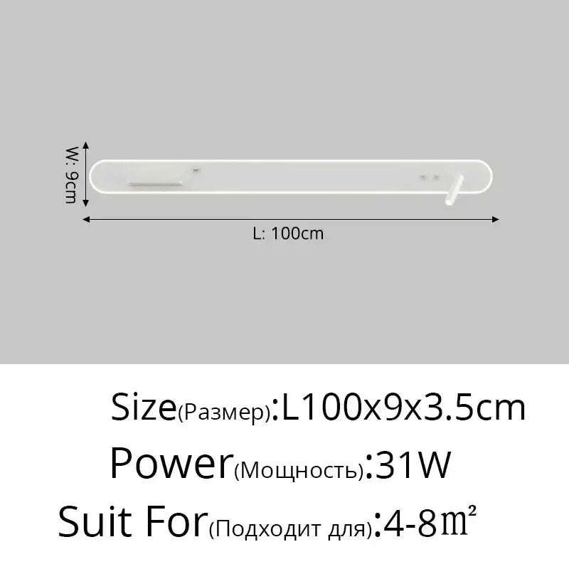 White minimalist soundbar with subtle control buttons beside modern white bedside wall lamp with wireless charging