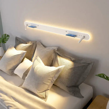 Modern white bedside wall lamp with led reading light and integrated phone charging slots for bedroom use