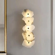 Modern white and beige stone brass wall lamp with five irregular discs and warm glow for bedroom decorbites brass wall lamp