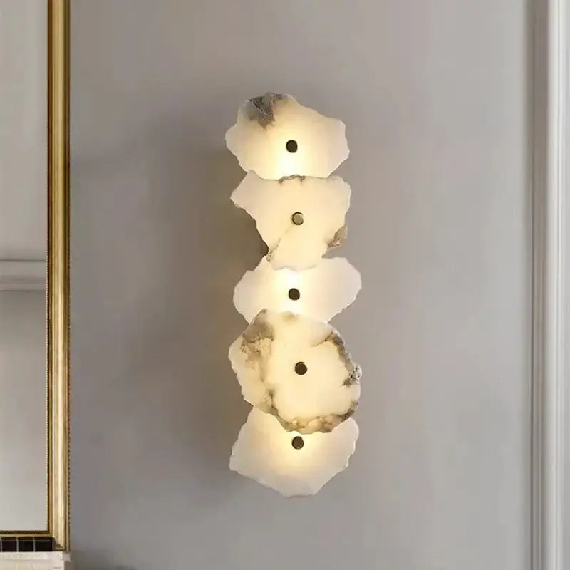 Modern white and beige stone brass wall lamp with five irregular discs and warm glow for bedroom decorbites brass wall lamp
