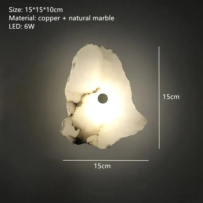 Modern white and beige stone brass wall lamp with copper and marble material emitting a warm glow decorbites brass wall lamp