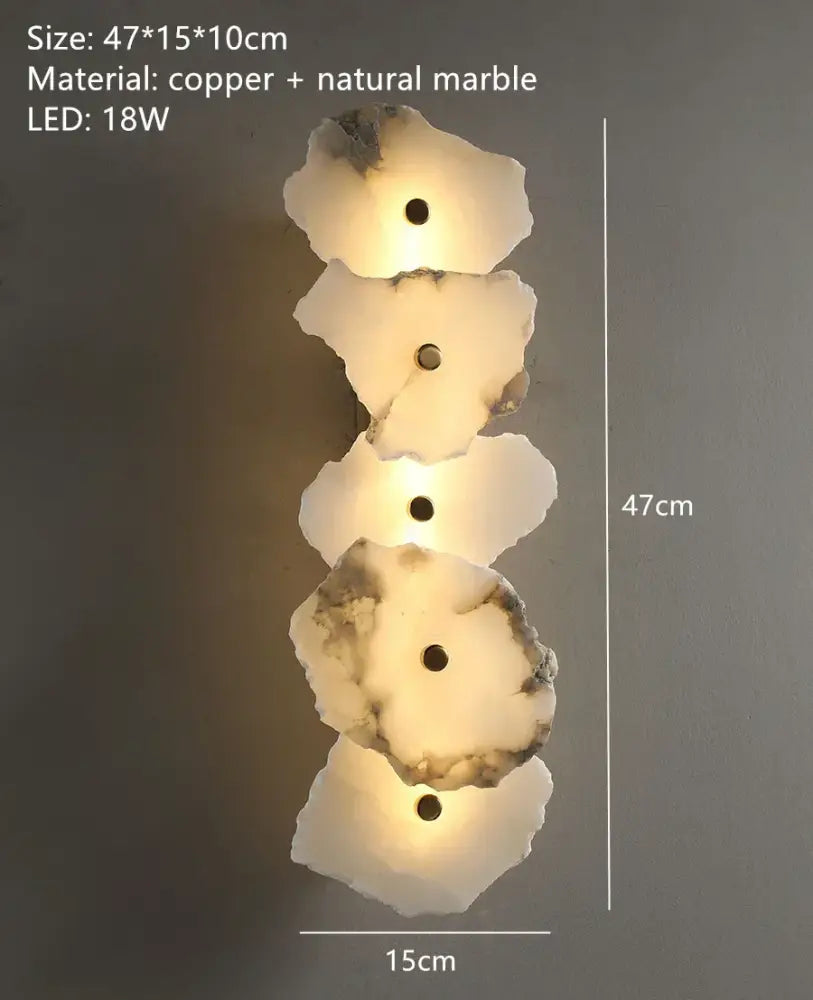 Modern white and beige stone brass wall lamp with four marble discs and copper accents for bedroom sconce decorbites brass wall lamp