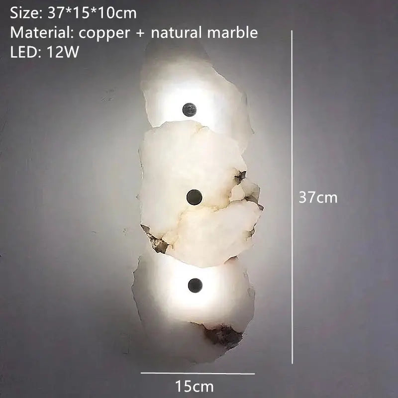 A modern three-tiered brass wall lamp with white and beige stone marble featuring embedded 12w leds for bedroom decor