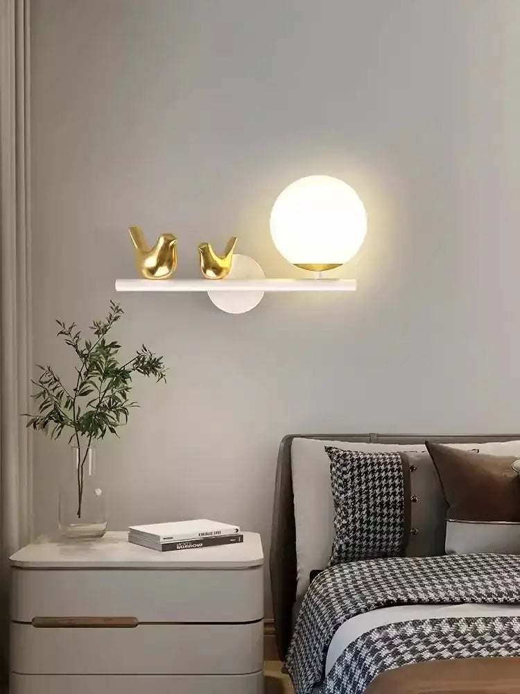 Modern white bird wall lights feature a spherical frosted glass globe with a gold-toned base and warm led glow for living room decorbites bird wall lights