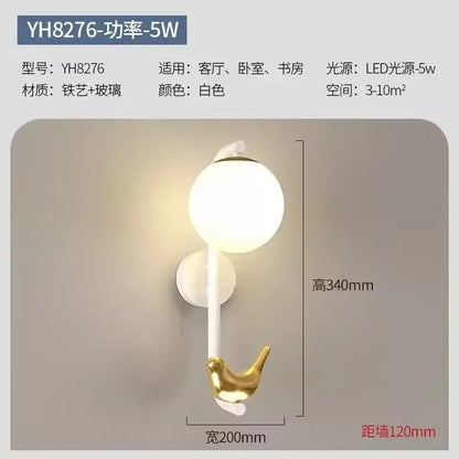 Modern white bird wall lights with led shelf featuring a spherical glass globe and gold iron bird hook for living room decorbites bird wall