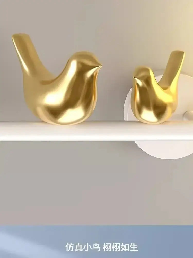 Modern white bird wall lights featuring two golden glossy bird wall lights with smooth minimalist decorbites design