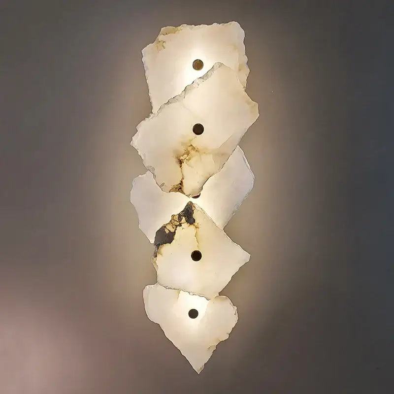 Modern white and black alabaster wall lamp featuring layered irregular white alabaster with brown veining by decorbites brass