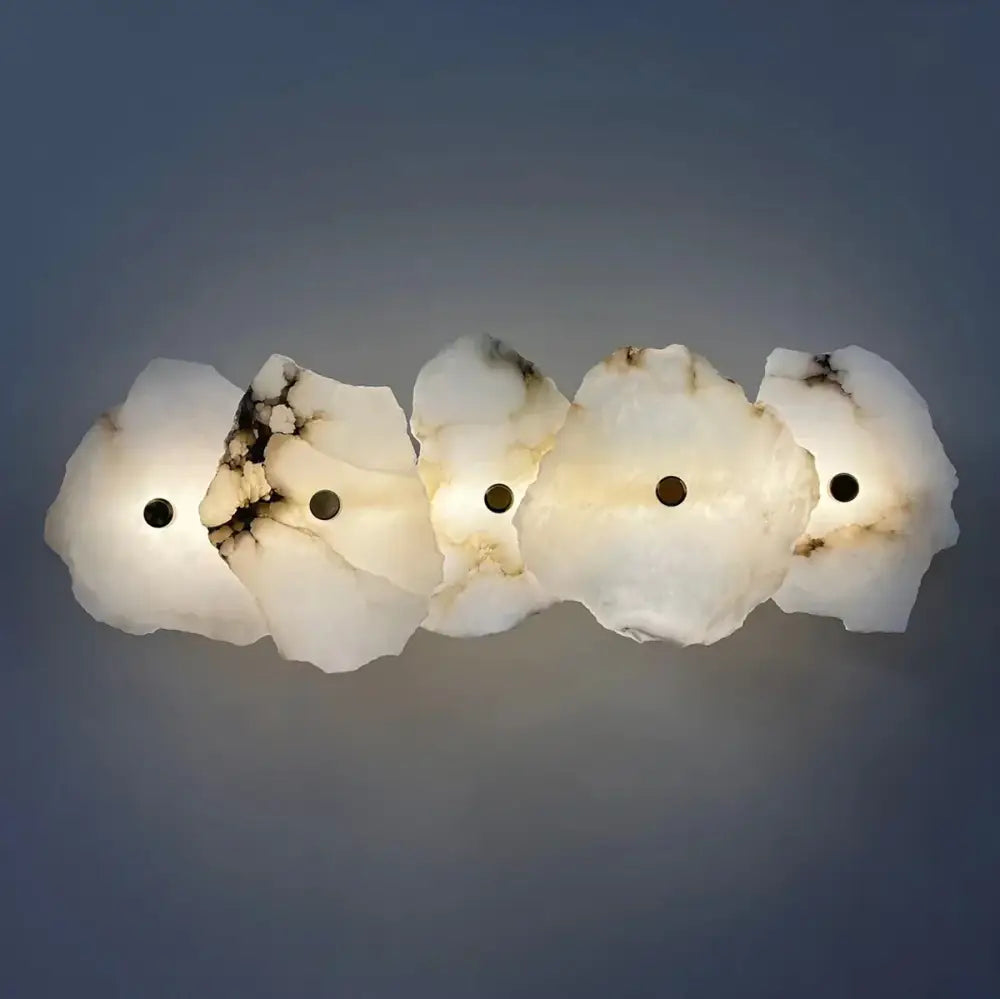 A modern five-piece white and black veined alabaster wall lamp with organic design for bedroom decorbites brass luxury sconce
