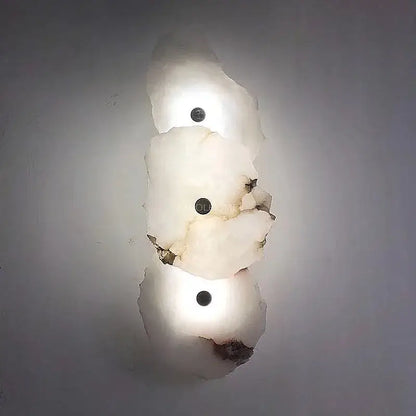 Modern white and black alabaster wall lamp with frosted glass shades and dark circular fixtures for luxury decorbites brass wall lamp