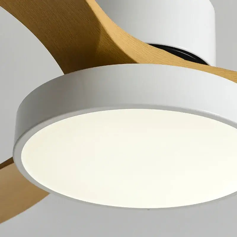 Modern white and black ceiling fan with natural wood blades and blade copper motor featuring a sleek white light fixture