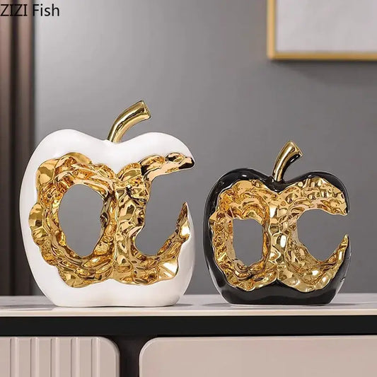 Modern white and black ceramic apple sculpture with gold leaf cutout design ideal for desk decoration