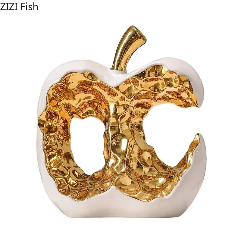 Modern white and black ceramic apple sculpture with glossy finish and metallic gold interior for desk decoration