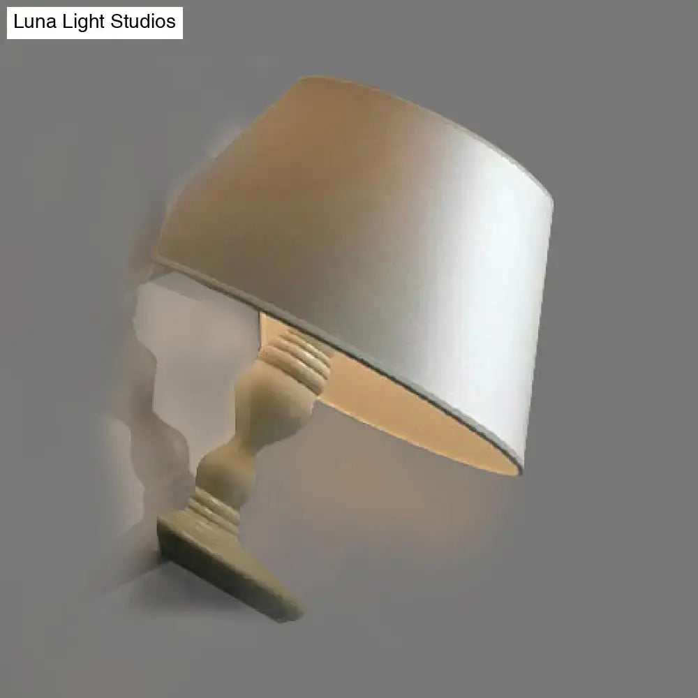 Modern white black cone ceramic wall sconce with cream satin lampshade on distressed wood base for bedroom lighting