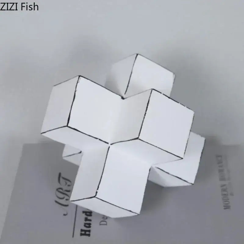 Modern white and black cube block sculpture made of folded paper with black outline detailing for living room art
