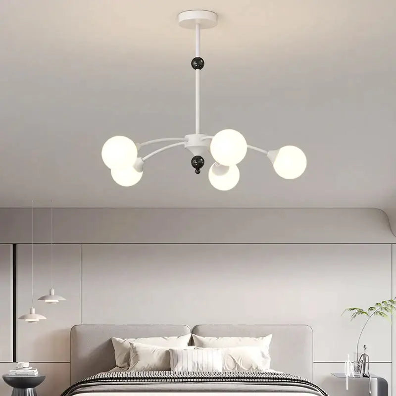 Modern white and black decorbites cream wind chandelier with five frosted glass globes and spherical accents for living room