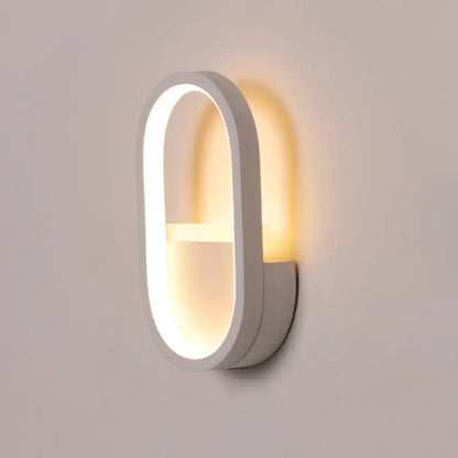 Modern white oval wall lamp with black ellipse frame and warm white led lighting for bedroom use