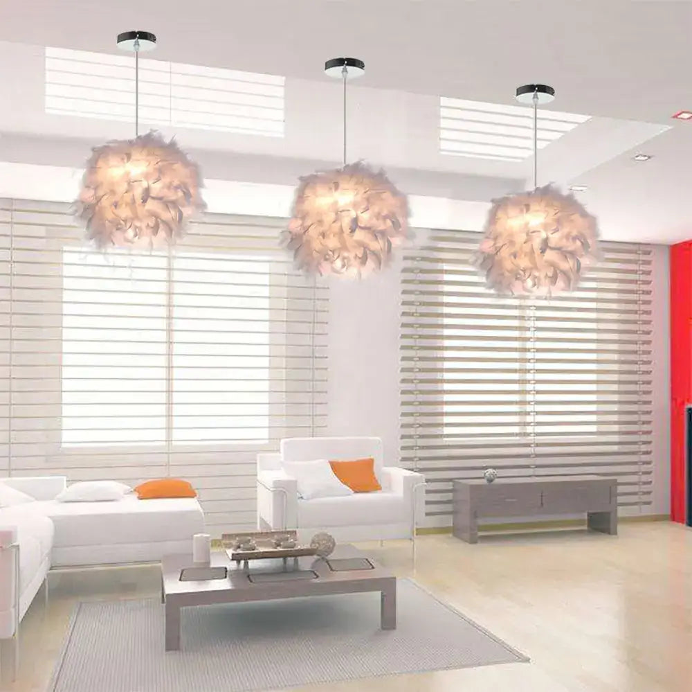 Three fluffy off-white feather pendant lights in modern white and black cloud design hanging from the ceiling