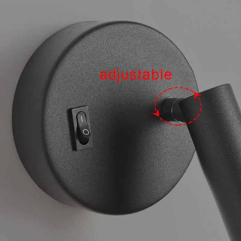 Modern white and black led wall lamp with black matte adjustable arm and circular base for bedroom reading light