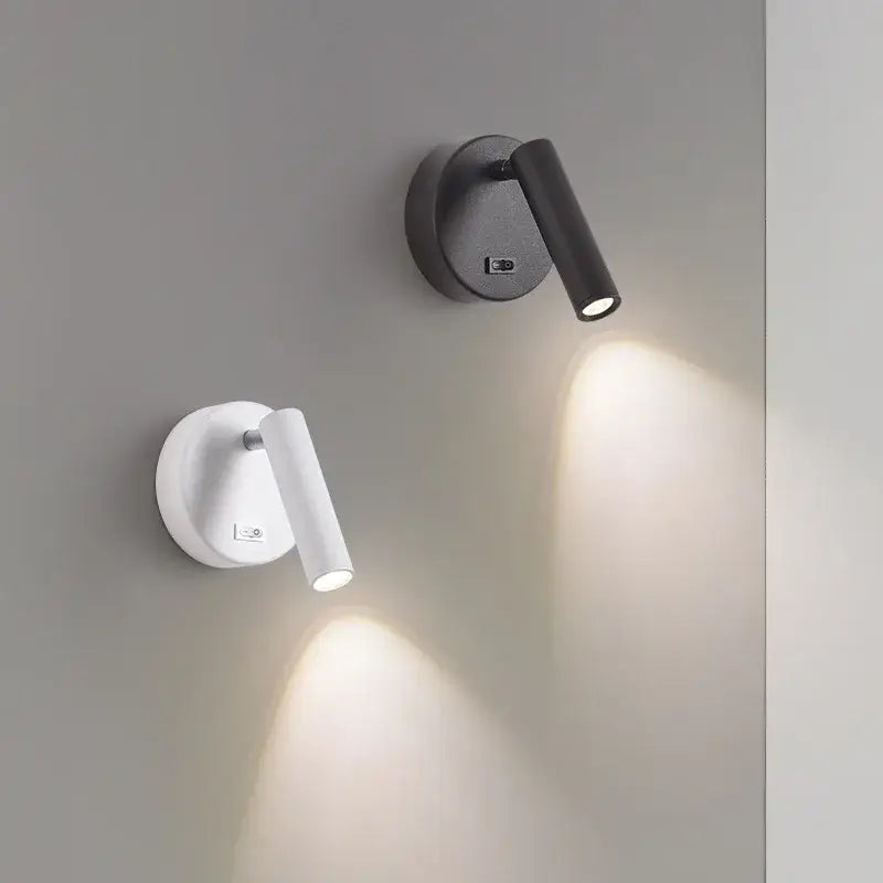 Modern white and black led wall lamp with adjustable cylindrical heads and soft focused illumination for reading