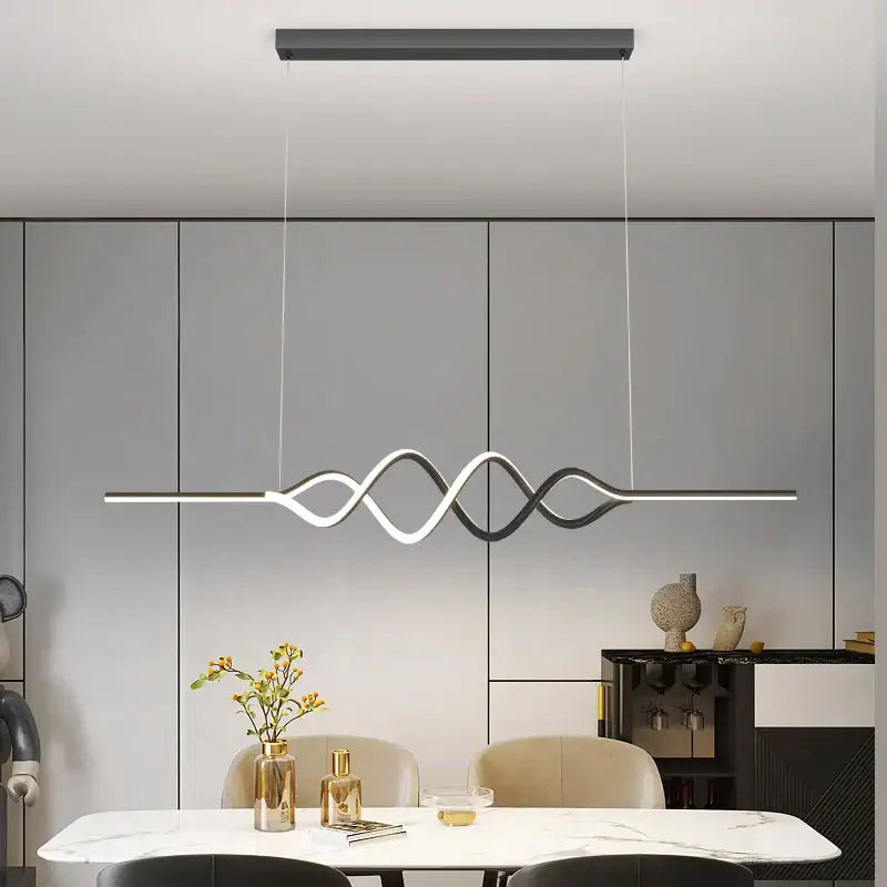Modern white and black living chandelier lights with sleek wave-like led pendant design above dining table