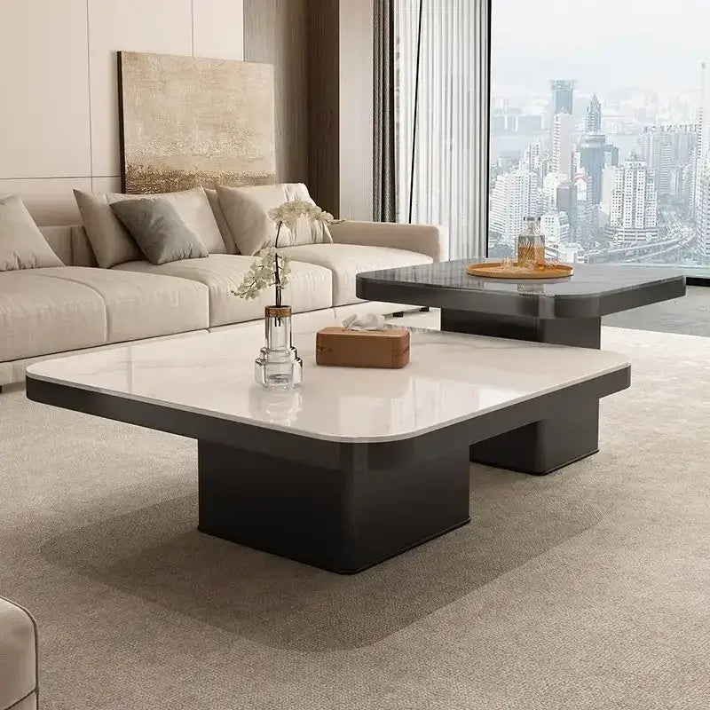 Modern white and black luxury rock square coffee table with a glossy white top and sleek black base for living room
