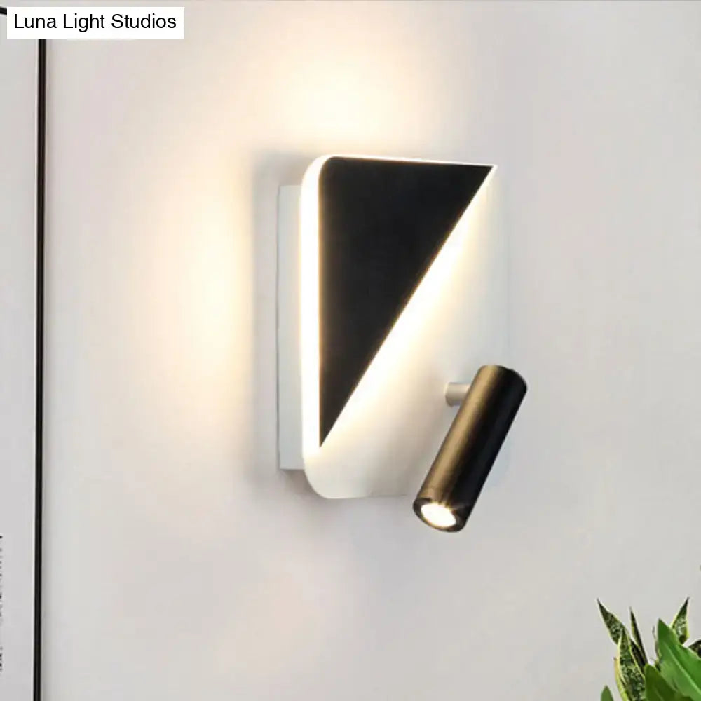 Modern white and black minimalist led spotlight wall lamp with a sleek black and white triangular design for bedroom use