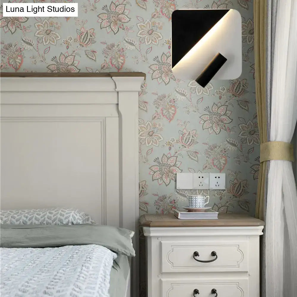 Modern white and black minimalist led spotlight wall lamp with sleek angular design for bedroom use