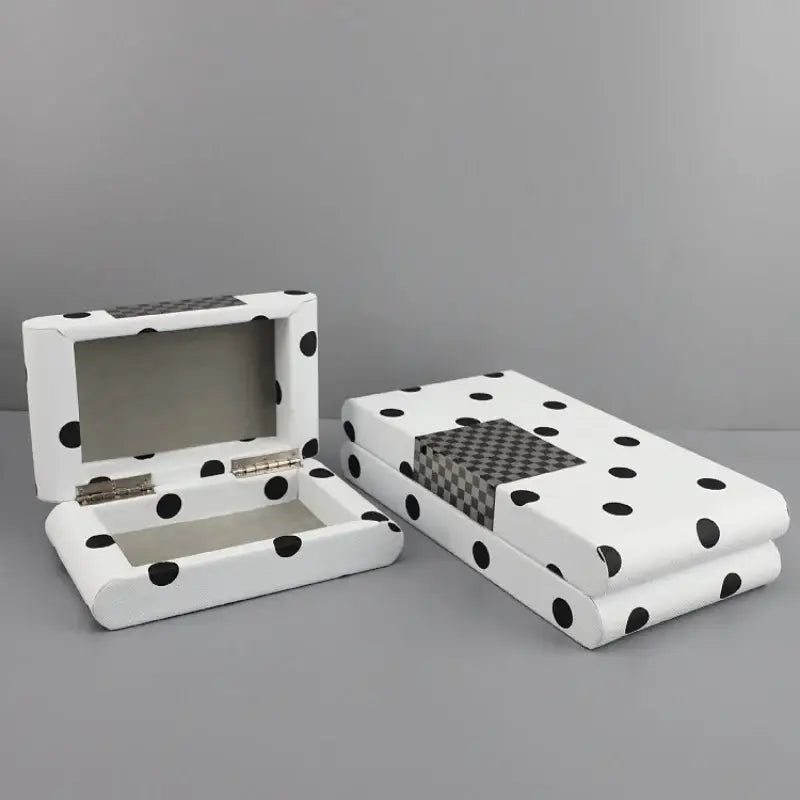 White rectangular leather storage box with black polka dot and checkered panel for bedroom organization