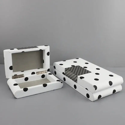 White rectangular leather storage box with black polka dot and checkered panel for bedroom organization