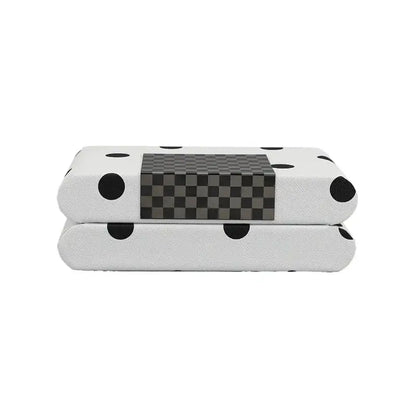 Modern white and black polka dot leather storage box with a central gray checkered panel for bedroom organization