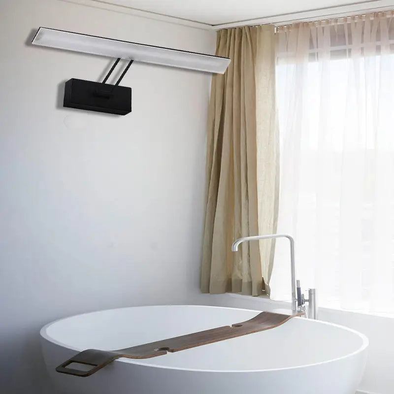 Modern white LED wall light with sleek black control box providing warm white light for bathroom use