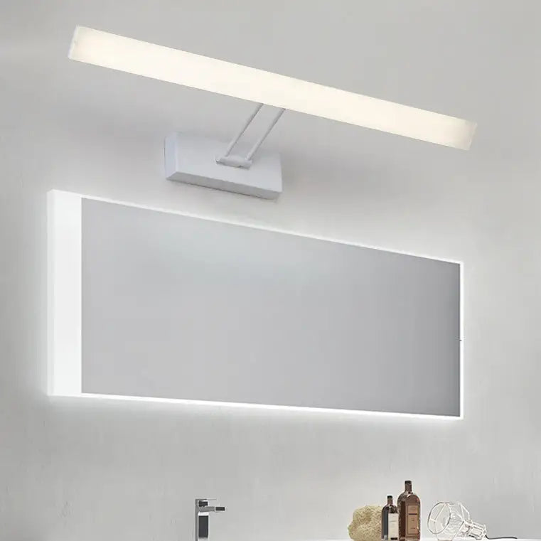 Modern white rectangular led wall light with sleek design and warm white light above integrated bathroom mirror