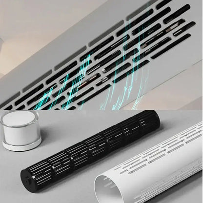 Black plastic ventilation grille with slotted design and metallic accents on the back of a modern white bladeless ceiling fan with led light