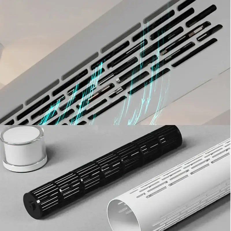 Black plastic ventilation grille with slotted design and metallic accents on the back of a modern white bladeless ceiling fan with led light