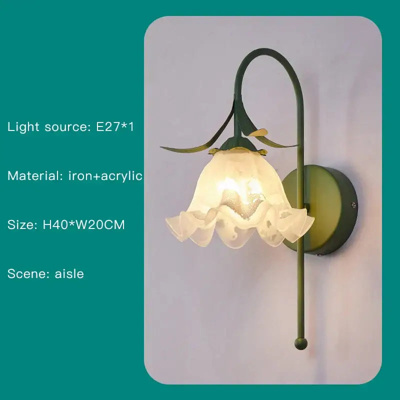 A delicate green iron and acrylic wall sconce with ruffled white glass shade complements decorbites branch ceiling chandelier
