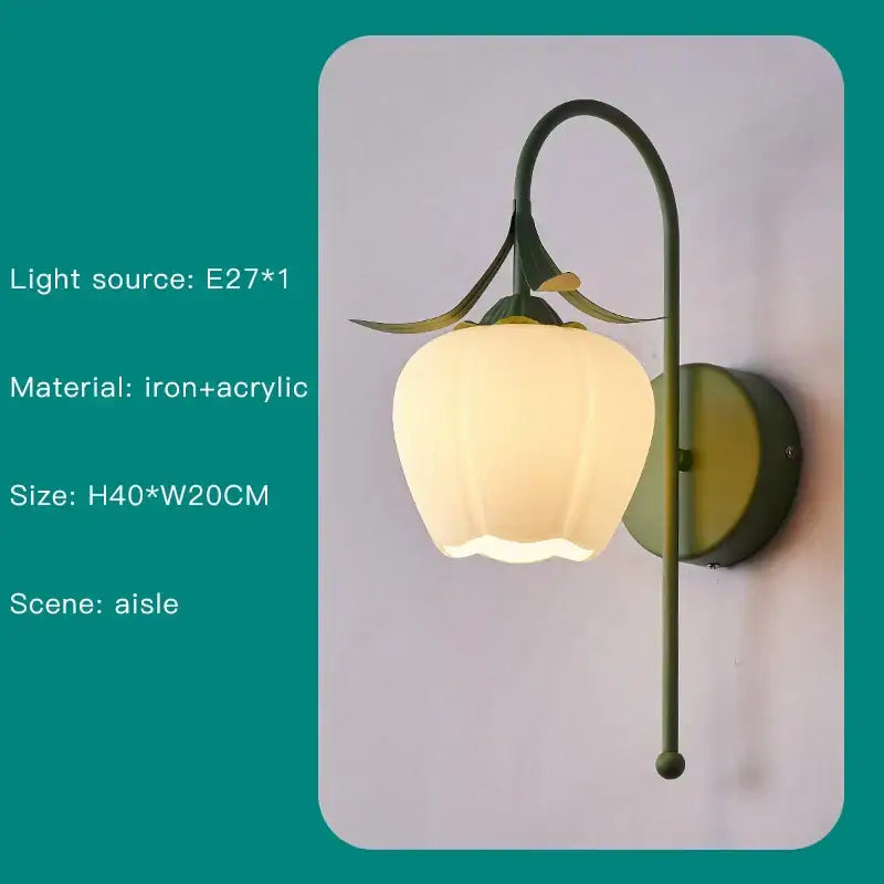 A delicate olive green wrought iron and acrylic wall sconce shaped like a blooming flower with leaf accents for decorbites branch ceiling chandelier decor