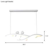 Decorbites modern white acrylic branch pendant light with bird design featuring warm white light illumination