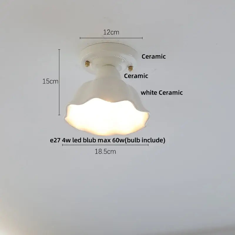 Modern white and brass ceramic led ceiling lamp with fluted bell-shaped shade and circular base for bedroom use