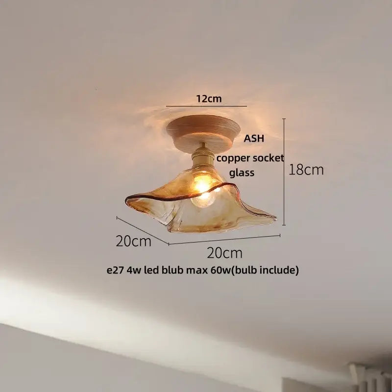 A warm-toned hand-blown glass ceiling lamp with copper socket and ash wood mount for modern ceramic led ceiling use
