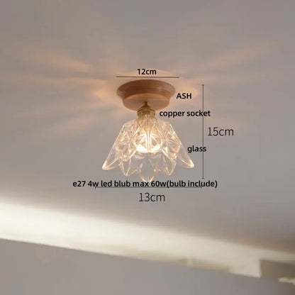 Modern white and brass ceramic led ceiling lamp featuring a clear faceted glass pendant with copper socket and wooden base