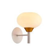 Modern white and brass wall sconce with frosted opal glass globe and matte metal arm for 220v-240v bedroom light