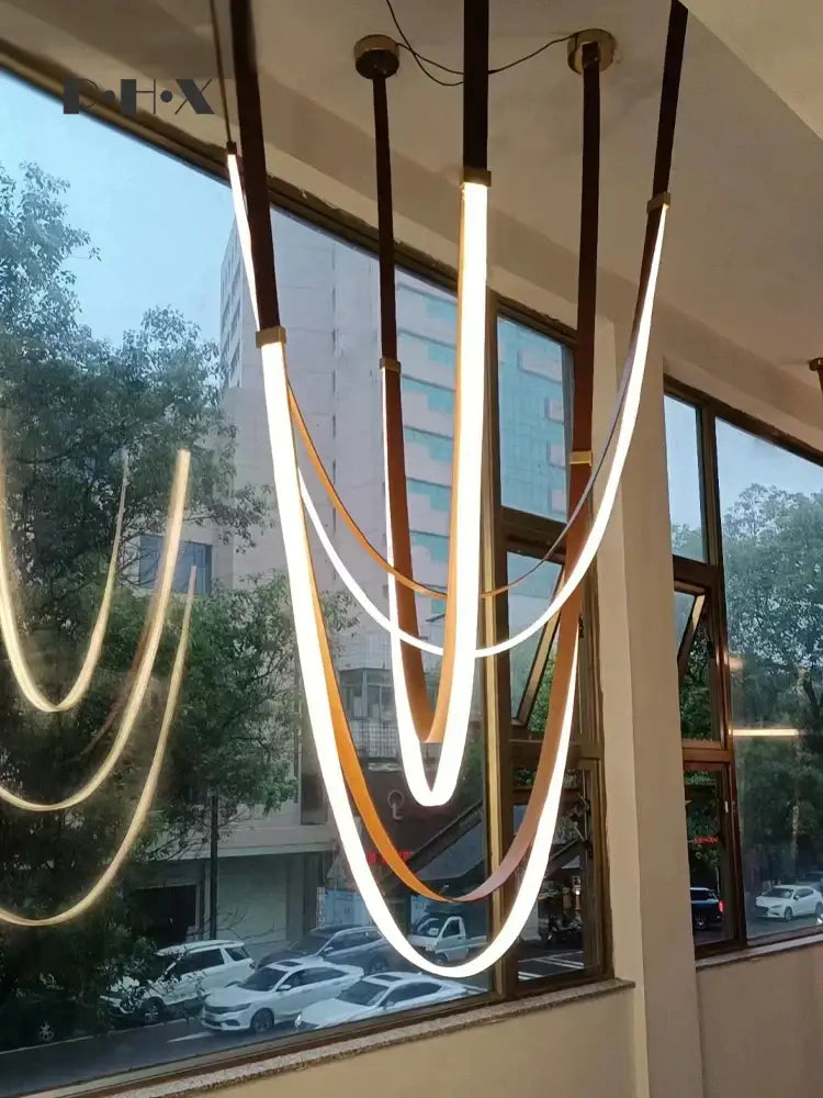 Modern white and brown designer villa chandelier with warm white led strips and dark brown leather-like cords decorbites designer villa