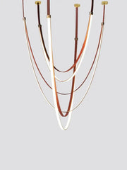 Modern white and brown leather designer villa chandelier with curved illuminated bands and gold-toned hardware by decorbites designer