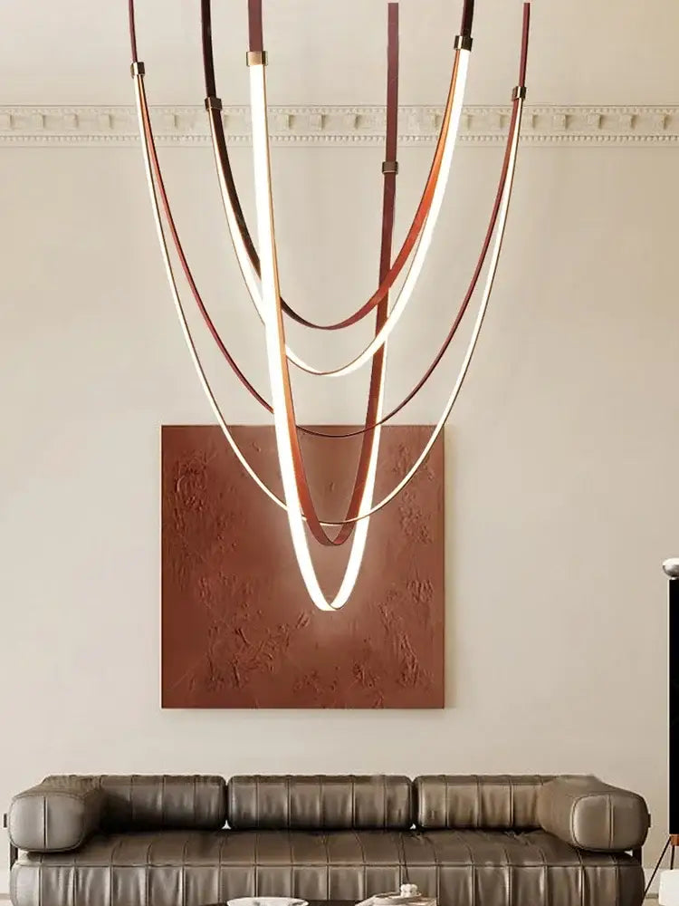 Modern white and brown leather chandelier with curved illuminated led strips in layered leather belt pendant light design