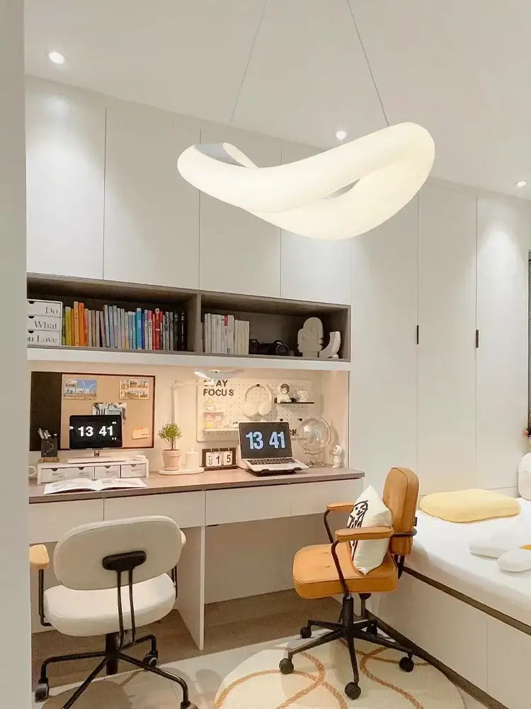 Modern white bubble led chandelier by decorbites with a smooth flowing design hanging above a desk as pendant light